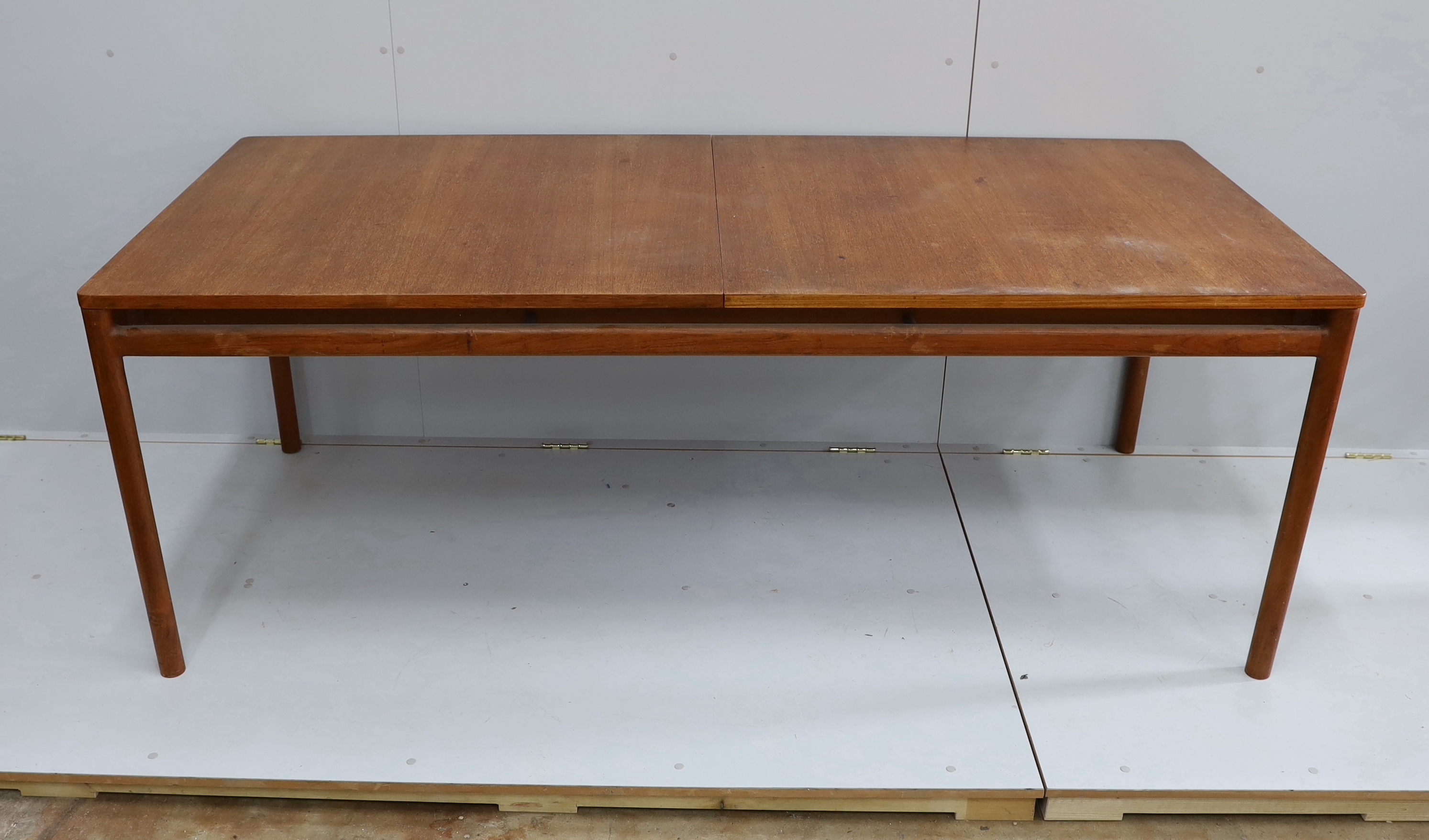 A mid century Danish design rectangular teak extending dining table, width 200cm, depth 92cm, height 73cm